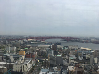 View of the city and the Akashi-Kaikyo Bridge from the Tenpozan Ferris Wheel. OSAKA, JAPAN.
