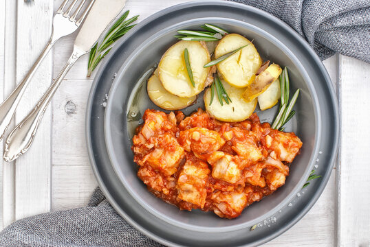 Baccala alla livornese - oven roast cod in tomato sauce with potatoes