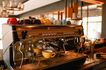 Fototapeta na wymiar Close-up of espresso pouring from coffee machine. Professional coffee brewing