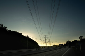 Intercity road In Thailand built through the mountains And has high voltage transmission towers