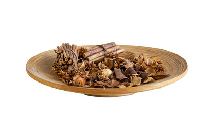 Top view of dried wood pieces in round wooden plate..