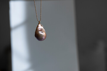 Natural baroque pearl pendant on a chain