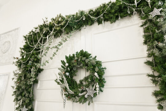 Christmas Wreath On The White Door