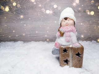 winter background with girl toy decor and snow