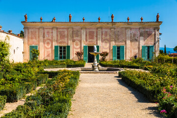 Lovely view of the Knight's Building (Palazzina del Cavaliere) and the Knight's Garden with the so called Monkeys Fountain situated on the eponymous rampart in the Boboli Gardens of Florence, Italy.