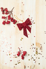 Christmas background. Red decorative ornaments of ribbons or bows or stars