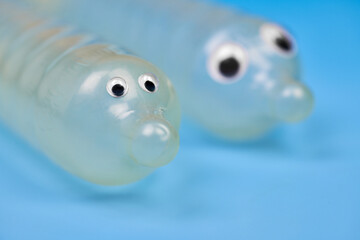 Two funny condom with eyes
