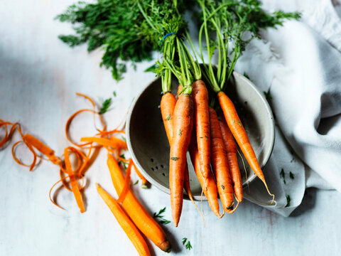 Peeled carrots and collander