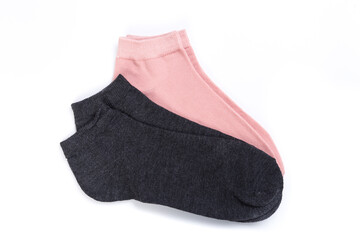two pairs of colored short socks on a white background, top view