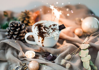 Hot chocolate with whipped cream and Christmas decor