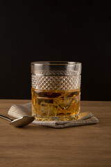 Whiskey glass on a black background