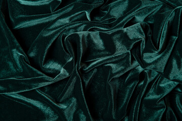 Tidewater green color velvet  fabric background. Close up of green textured background.