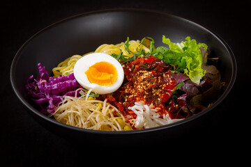 Korean food, JJolmyeon which is mixed with cold chewy noodles with vegetables and spicy sauce