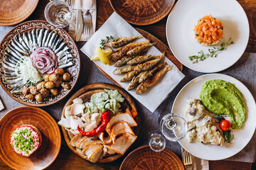delicious European and Slavic cuisine on the big table waiting for guests. table with food, top view