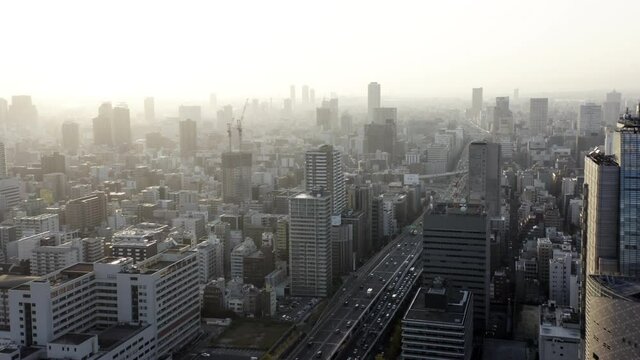 Modern city skyline aerial view of Osaka, Japan.