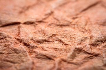Extreme closeup of red handmade paper