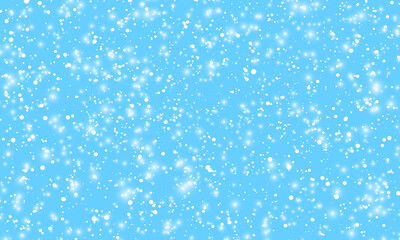Snow background. Winter snowfall. White snowflakes on blue sky. Christmas background. Falling snow.