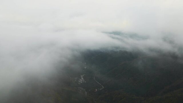 evening cloudy sky panning down to city view