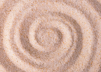 Fototapeta na wymiar Circles in the form of a snail in the sand.Abstract background of spiral lines.Soft focus.Concept for decorating covers, wallpapers,surfaces.