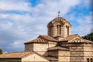 Athens, Greece. Aghios Athanasios church upper part in Thissio area, blue cloudy sky background