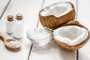 organic cosmetics with coconut on white background