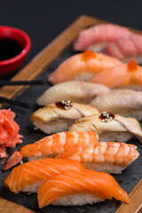 Different types of sushi and rolls in restaurant
