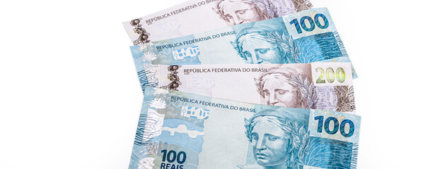 one hundred and two hundred reais bills, money from Brazil. Payment and credit, profit or wealth concept