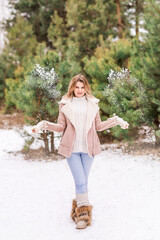 Naklejka premium Christmas Girl.Winter woman Blowing Snow