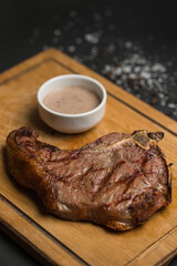 Meat steak and sauce in restaurant