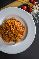 Cooked pasta with vegetables and tomatoes