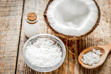 coconut oil for body care in cosmetic concept on old wooden table