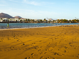 Girl walking and chilling in the beach.