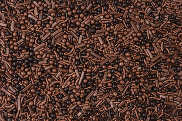 delicious chocolate shavings noodles as background closeup . Textures