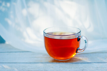 mug of tea on a white wooden background. time for rest and break