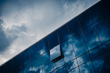 Fototapeta na wymiar corporate glass building with only window open