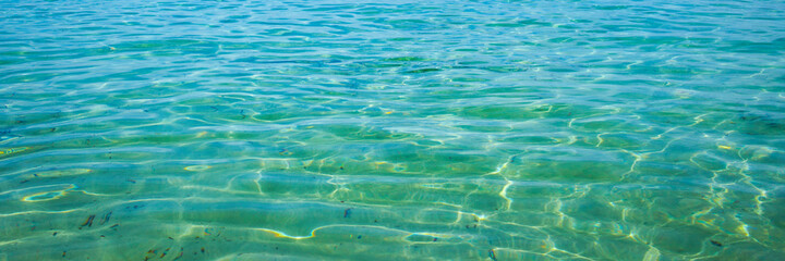 Fototapeta na wymiar Calm sea, blue water, sky and horizon scene in Tunisia. Vacation relaxing concept. Web banner for your design.