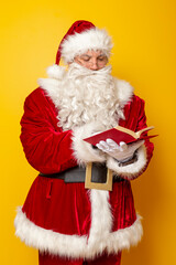 Santa Claus reading a book