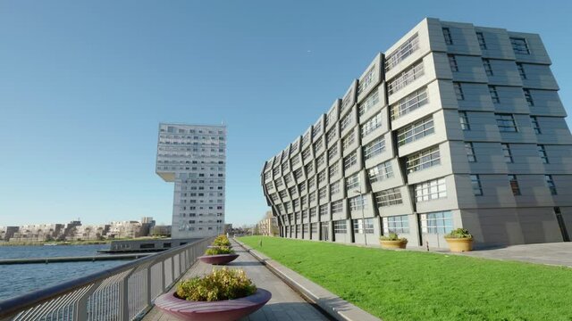 Modern apartment buildings the center of Almere, The Netherlands. Panning shot. 