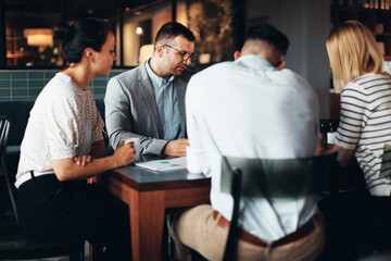 Businesspeople working in an office cafe