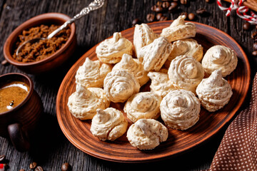Meringue cookies on a dark wooden background