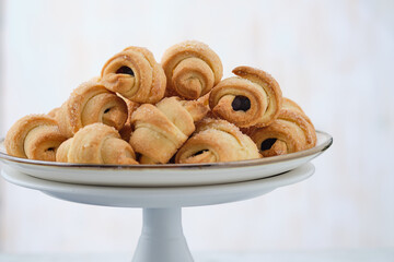 Homemade bagel cookies with marmalade inside. Sweet croissant cookies. Selective focus