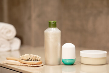 Obraz na płótnie Canvas Hair care products on a wooden table on a neutral background. 