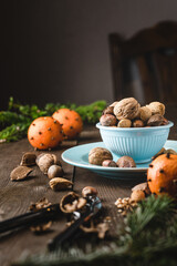 Christmas photo with Christmas nuts mix and oranges. nutcracker