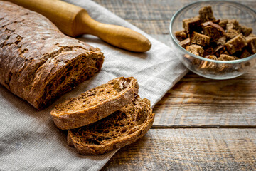 making crumbs from rye bread wooden background
