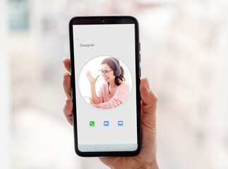 Woman calling to designer using smartphone
