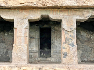 Fototapeta na wymiar Ancient rock cut unfinished man-made cave temple in the historic site of Mamandur village, Kanchipuram, Tamilnadu, India.