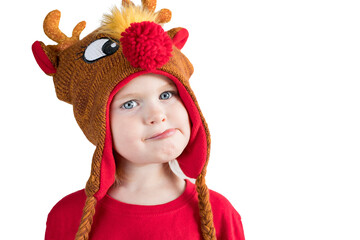 Christmas child on white isolated background. Little kid with funny,   confused and thoughtful face expression in holiday reindeer hat. Toddler girl in Christmas costume thinking about something