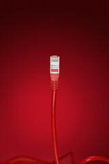 Data cable plug over red background