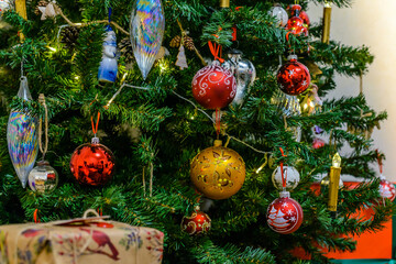 Beautiful Christmas toys hang on the tree on New Year