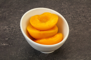 Marinated peaches fruit in the bowl